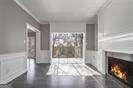 2769 Peachtree Rd NE Unit 10, Atlanta, GA 30305 - unfurnished bedroom featuring a lit fireplace