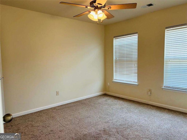 5123 Upper Elm St, Atlanta, GA 30349 - empty room featuring carpet floors, baseboards, and a ceiling fan