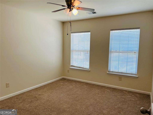 5123 Upper Elm St, Atlanta, GA 30349 - carpeted empty room with baseboards and ceiling fan