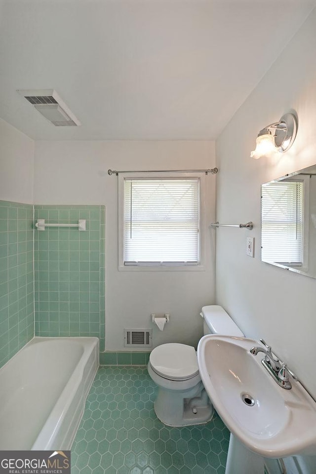 2394 Burch Cir NE, Brookhaven, GA 30319 - bathroom with a bath and tile patterned flooring