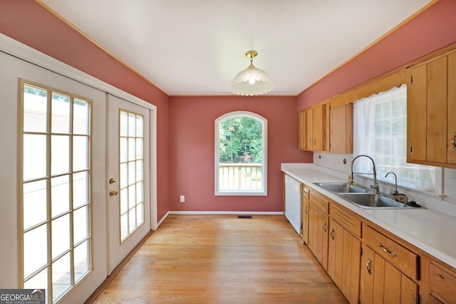 2394 Burch Cir NE, Brookhaven, GA 30319 - kitchen with light countertops, dishwasher, and light wood finished floors