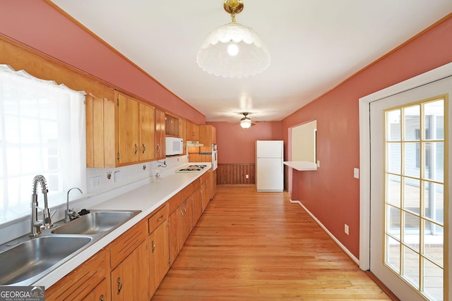 2394 Burch Cir NE, Brookhaven, GA 30319 - kitchen with white appliances, a sink, light wood finished floors, and light countertops