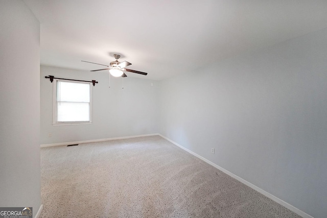 2394 Burch Cir NE, Brookhaven, GA 30319 - empty room with a ceiling fan and light carpet