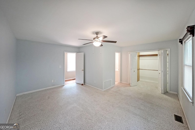 2394 Burch Cir NE, Brookhaven, GA 30319 - unfurnished room with a ceiling fan, light carpet, and baseboards