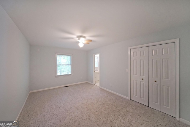 2394 Burch Cir NE, Brookhaven, GA 30319 - unfurnished bedroom featuring baseboards, carpet flooring, ceiling fan, and a closet