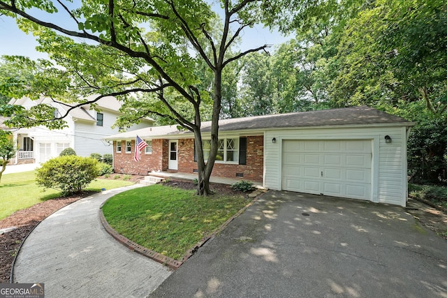 2394 Burch Cir NE, Brookhaven, GA 30319 - view of front of house featuring brick siding, driveway, an attached garage, and a front yard