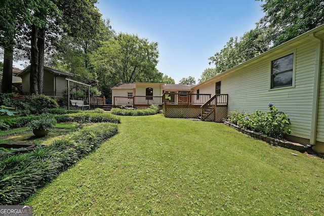 2394 Burch Cir NE, Brookhaven, GA 30319 - view of green lawn featuring a wooden deck and stairs