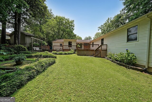 2394 Burch Cir NE, Brookhaven, GA 30319 - view of grassy yard with a deck and stairway