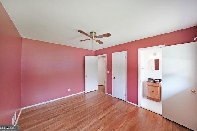 2394 Burch Cir NE, Brookhaven, GA 30319 - unfurnished bedroom featuring light wood-style flooring and a ceiling fan