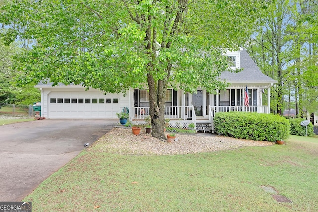 403 Rustic Ridge Cir, Lawrenceville, GA 30043 - view of property hidden behind natural elements with covered porch, a garage, driveway, and a front lawn