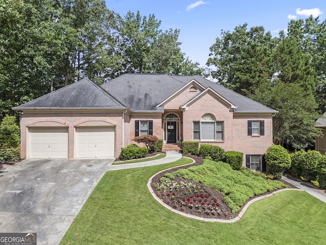 569 Fairway Dr, Woodstock, GA 30189 - view of front of property with brick siding, a garage, driveway, and a front lawn