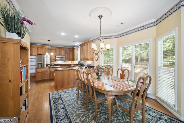 569 Fairway Dr, Woodstock, GA 30189 - dining space featuring a chandelier, ornamental molding, light wood finished floors, and recessed lighting