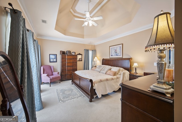 569 Fairway Dr, Woodstock, GA 30189 - carpeted bedroom with a tray ceiling, ornamental molding, and ceiling fan