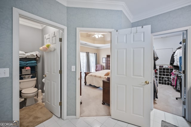 569 Fairway Dr, Woodstock, GA 30189 - ensuite bathroom with crown molding, a ceiling fan, tile patterned flooring, and a spacious closet
