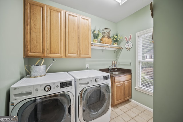 569 Fairway Dr, Woodstock, GA 30189 - laundry room featuring separate washer and dryer, cabinet space, and light tile patterned floors