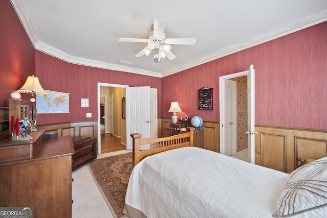 569 Fairway Dr, Woodstock, GA 30189 - bedroom with a wainscoted wall, ornamental molding, and a ceiling fan