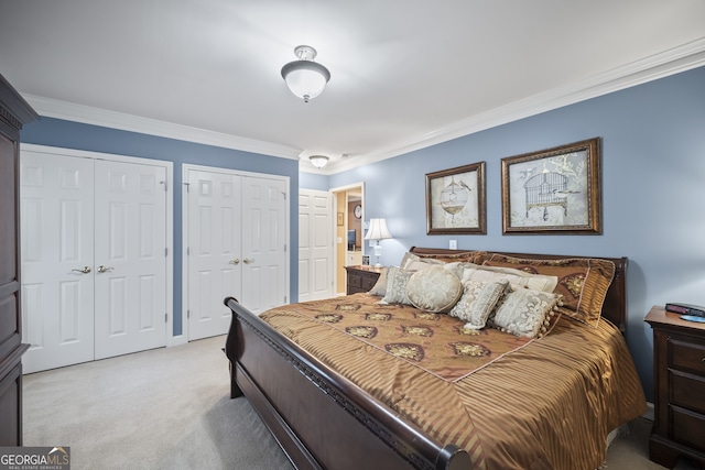569 Fairway Dr, Woodstock, GA 30189 - bedroom with multiple closets, crown molding, and light carpet