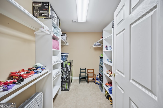 569 Fairway Dr, Woodstock, GA 30189 - walk in closet featuring light colored carpet