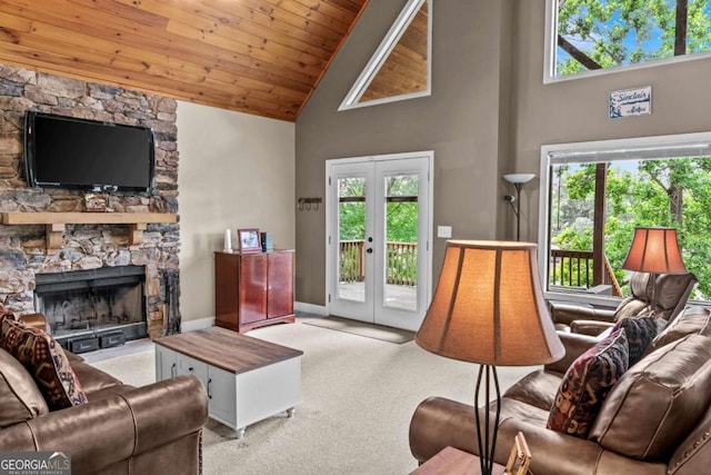291 Thomas Dr, Eatonton, GA 31024 - living room with high vaulted ceiling, wood ceiling, french doors, carpet flooring, and a stone fireplace