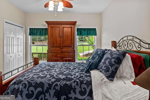 291 Thomas Dr, Eatonton, GA 31024 - bedroom with multiple windows, a ceiling fan, and a closet