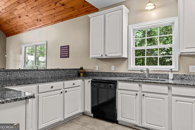 291 Thomas Dr, Eatonton, GA 31024 - kitchen with black dishwasher, a sink, light tile patterned floors, white cabinetry, and lofted ceiling