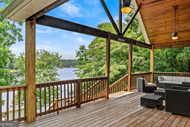 291 Thomas Dr, Eatonton, GA 31024 - wooden deck featuring outdoor lounge area, a water view, and view of scattered trees