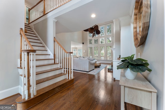 10135 High Falls Pointe, Johns Creek, GA 30022 - stairs featuring a ceiling fan, a towering ceiling, wood finished floors, and baseboards
