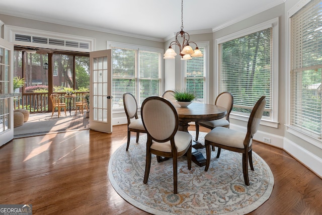10135 High Falls Pointe, Johns Creek, GA 30022 - dining room with a chandelier, plenty of natural light, crown molding, and wood finished floors