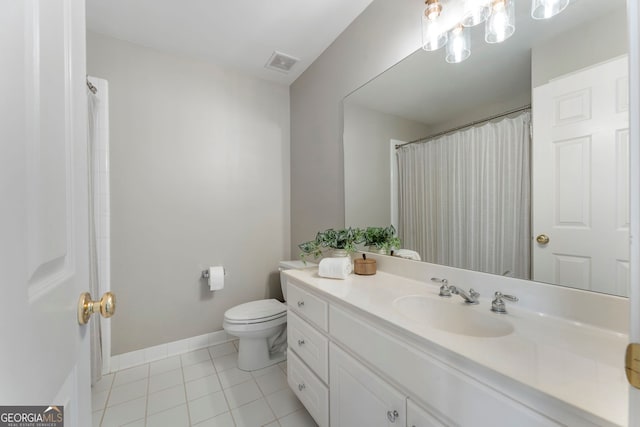 10135 High Falls Pointe, Johns Creek, GA 30022 - full bath with toilet, tile patterned floors, vanity, and baseboards