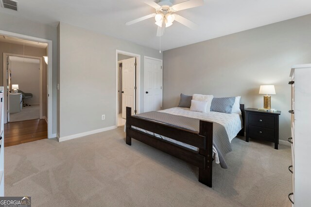 10135 High Falls Pointe, Johns Creek, GA 30022 - bedroom with attic access, light carpet, baseboards, and ceiling fan