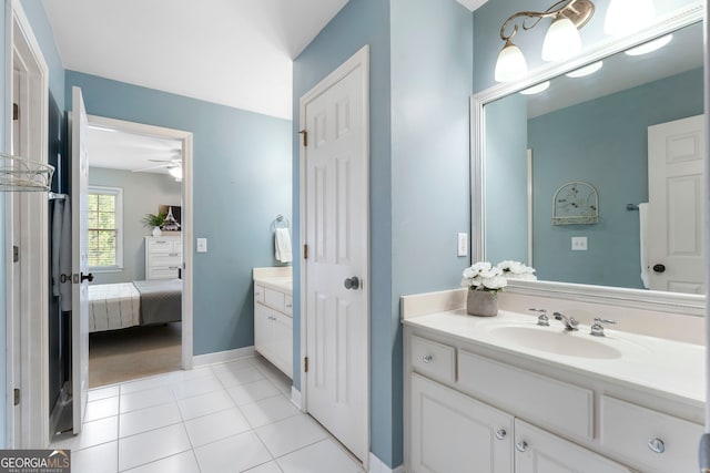 10135 High Falls Pointe, Johns Creek, GA 30022 - bathroom with vanity, ensuite bath, tile patterned flooring, ceiling fan, and baseboards