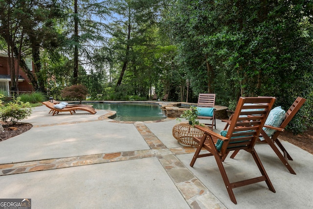 10135 High Falls Pointe, Johns Creek, GA 30022 - view of pool with a patio and a pool with connected hot tub