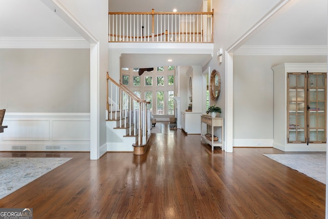 10135 High Falls Pointe, Johns Creek, GA 30022 - foyer with stairs, crown molding, ceiling fan, wood finished floors, and baseboards