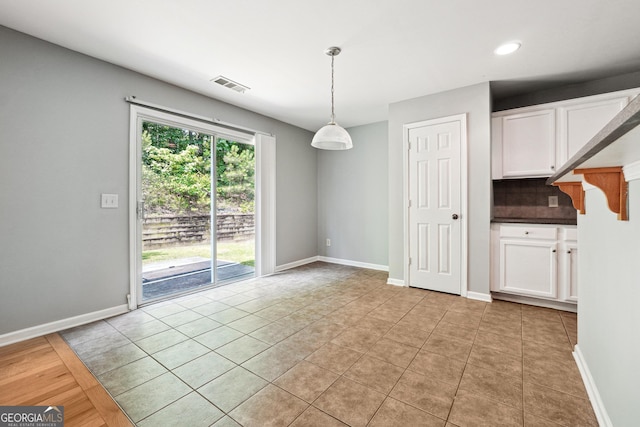 1875 Cutleaf Creek Rd, Grayson, GA 30017 - unfurnished dining area with light tile patterned floors, baseboards, and recessed lighting