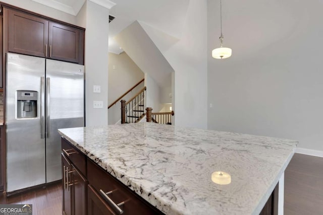 3005 Devoncroft St SE, Smyrna, GA 30080 - kitchen with stainless steel fridge with ice dispenser, dark wood finished floors, light stone countertops, a kitchen island, and dark brown cabinetry