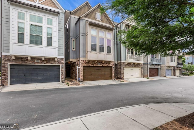 3005 Devoncroft St SE, Smyrna, GA 30080 - multi unit property featuring a garage, stone siding, and driveway