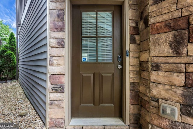 3005 Devoncroft St SE, Smyrna, GA 30080 - doorway to property with stone siding