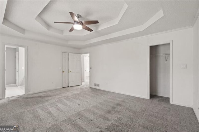 4956 Braeburn Trce NW, Acworth, GA 30102 - unfurnished bedroom with a tray ceiling, carpet, a ceiling fan, and baseboards