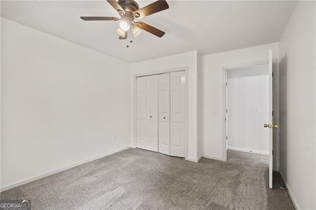 4956 Braeburn Trce NW, Acworth, GA 30102 - unfurnished bedroom featuring carpet, baseboards, a closet, and ceiling fan