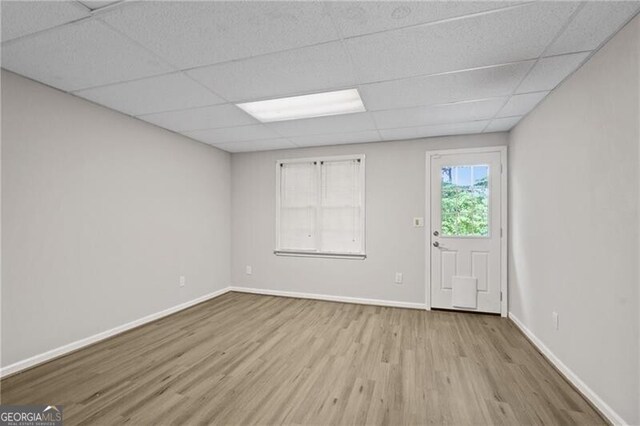 4956 Braeburn Trce NW, Acworth, GA 30102 - unfurnished room with wood finished floors, a paneled ceiling, and baseboards
