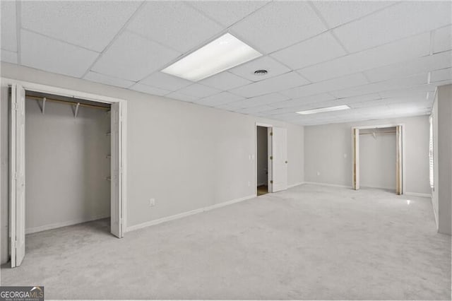 4956 Braeburn Trce NW, Acworth, GA 30102 - below grade area featuring carpet floors, a drop ceiling, and baseboards
