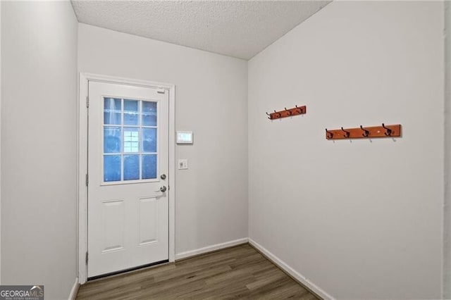 4956 Braeburn Trce NW, Acworth, GA 30102 - doorway to outside featuring wood finished floors, baseboards, and a textured ceiling