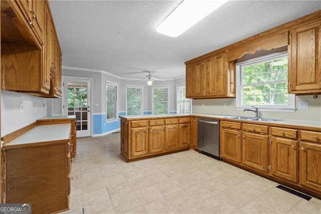 4956 Braeburn Trce NW, Acworth, GA 30102 - kitchen featuring dishwasher, a peninsula, brown cabinetry, light countertops, and a textured ceiling