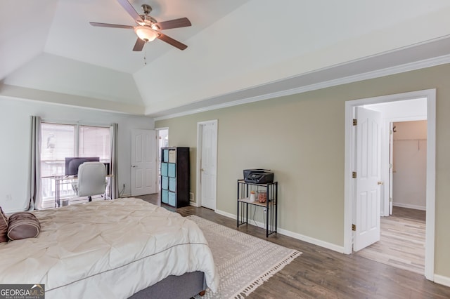 2005 Ashton Pointe Dr, Dacula, GA 30019 - bedroom featuring wood finished floors, a raised ceiling, baseboards, lofted ceiling, and ornamental molding