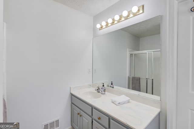 2005 Ashton Pointe Dr, Dacula, GA 30019 - full bath with vanity, a stall shower, and a textured ceiling