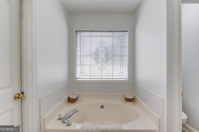 2005 Ashton Pointe Dr, Dacula, GA 30019 - full bathroom featuring a bath and toilet