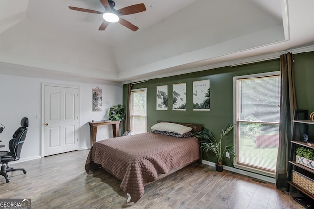 2005 Ashton Pointe Dr, Dacula, GA 30019 - bedroom with a tray ceiling, wood finished floors, baseboards, and a ceiling fan