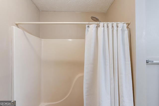 2005 Ashton Pointe Dr, Dacula, GA 30019 - full bathroom with a shower with curtain and a textured ceiling