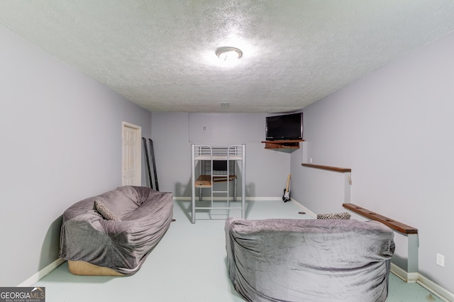 2005 Ashton Pointe Dr, Dacula, GA 30019 - living area featuring a textured ceiling and baseboards