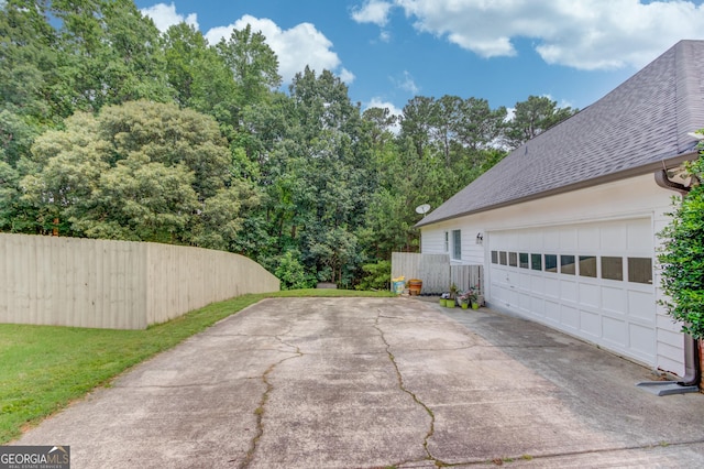 2005 Ashton Pointe Dr, Dacula, GA 30019 - view of patio with concrete driveway and a garage